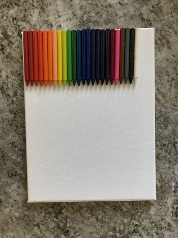 hot glue the crayons to the canvas
